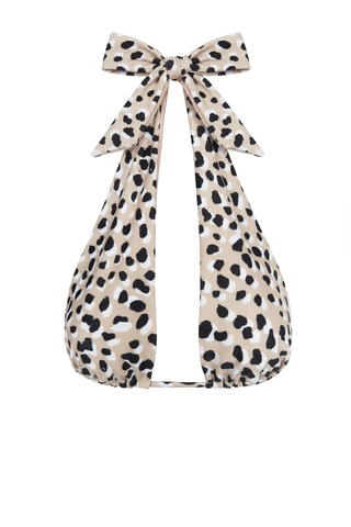 Leopard print bikini top with a large bow on a white background